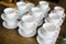 Stacked empty teacups with teaspoons at a function over