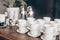 Stacked empty teacups with teaspoons at a function over