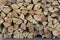 Stacked firewood for kindling a stove, fireplace, barbecue or bonfire. Firewood background. Wood texture
