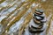 Stacked flat stones on a wet stone plate