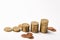 Stacked golden coins and piles spread on a white background