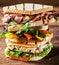 Stacked grilled sandwiches with fresh ingredients