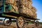 Stacked hay bales on antique amish wagon