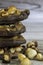 Stacked hazelnut and chocolate chip cookies and hazelnuts