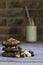 Stacked hazelnut and chocolate chip cookies and milk bottle