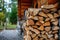 Stacked logs of firewood. Preparation for the heating season