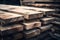 Stacked lumber on warehouse shelf, available for construction purchase. Wood planks stored indoors, suitable for