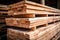 Stacked lumber on warehouse shelf, available for construction purchase. Wood planks stored indoors, suitable for