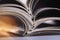 Stacked Magazines on light background, close-up