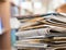 Stacked Magazines on light background, close-up