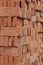 Stacked of orange bricks for building constuction