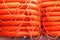 Stacked orange rescue round buoy, sea marine lifesaver