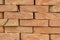 Stacked orange solid clay brick background 2