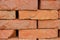 Stacked orange solid clay brick background