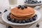 Stacked pancakes edged with blueberries