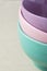 Stacked of Pastel Multicolored Bowls on Linen Table Cloth. Holiday Baking Cooking Essentials Concept