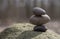 Stacked pebbles on a big rock