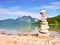 Stacked pebbles on the lake shore. Balanced stones stack