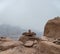 Stacked pile of stones and rocks on tranquil desert background