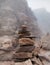 Stacked pile of stones and rocks on tranquil desert background