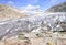 Stacked rocks with blue sky and Rhone glacier