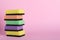 Stacked sponges on pink background. Space for text