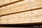 Stacked stacks of wooden planks. Lumber warehouse, wood drying