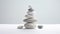 Stacked stones on white background symbolizing zen and balance