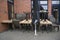 Stacked tables and chairs in a closed street restaurant during lockdown due to coronavirus pandemic