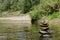 Stacked up balanced rocks in river