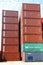 Stacked variegated shipping containers