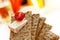 Stacked wholemeal crispbread with soft cheese and cherry tomato