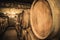 Stacked wine barrels in the old cellar of the winery