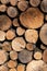 Stacked wood logs. Firewood pattern. Wooden background