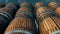 Stacked Wooden Oak Whiskey Wine or Beer Barrels sitting in Rows 4k
