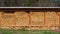 Stacked in a woodpile for heating the house in winter. Wood fuel