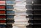 Stacking books with blur bookshelfs background in library room