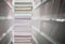 Stacking books with blur bookshelfs background in library room