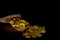 Stacking gold Coin in broken jar on black background, .Money stack for business planning investment and saving future