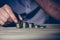 Stacking money coins, business casual man on table