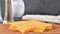 Stacking slices of cheddar cheese on a cutting board, stop motion