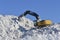 Stacking snow excavator