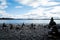 Stacking stones on pebble beach