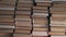 Stacks of book volumes in the room. Bookworm library interior.