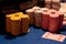 Stacks of casino betting chips stacked with a playing card 4 of Diamonds