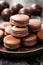 Stacks of chocolate macarons, delicious French dessert