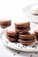 Stacks of chocolate macarons, delicious French dessert