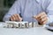 Stacks of coins arranged in a row from low to high, analogous to the growth of money, investing in stocks, stock market chart