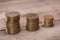 Stacks of coins on wooden tabletop