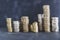 Stacks of different golden and silver coins creating a big amount of savings, abundance and wealth